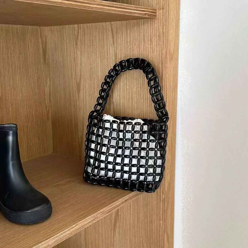 Portable Handmade Beaded Woven Bag Pure Color Vintage Hollow Out Bag Boho Creative Openwork Bag Vacation Beach
Portable Handmade Beaded Woven Bag Pure Color Vintage Hollow Out Bag Boho Creative Openwork Bag Vacation Beach