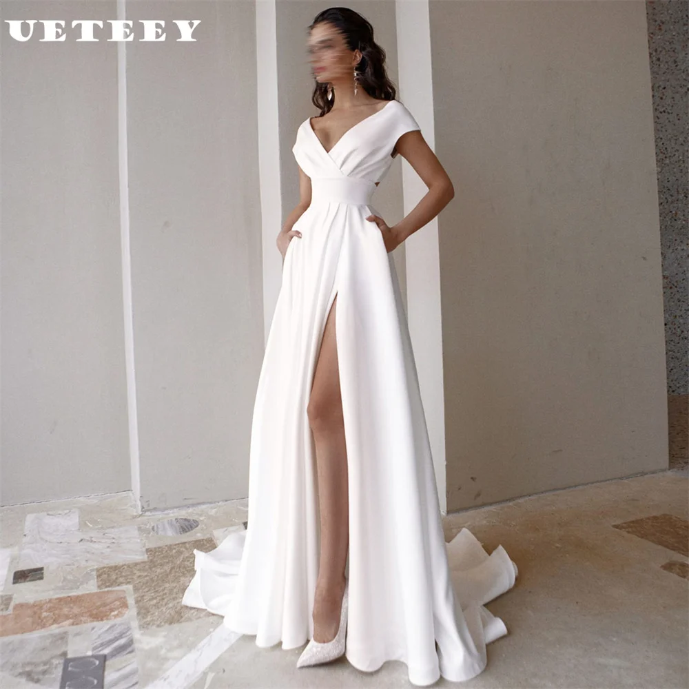 UETEEY Customized V Neck Cap Sleeves Crepe Pleats A Line Wedding Dress High Side Slit Zipper Back Court Train Bridal Gown
UETEEY Customized V Neck Cap Sleeves Crepe Pleats A Line Wedding Dress High Side Slit Zipper Back Court Train Bridal Gown