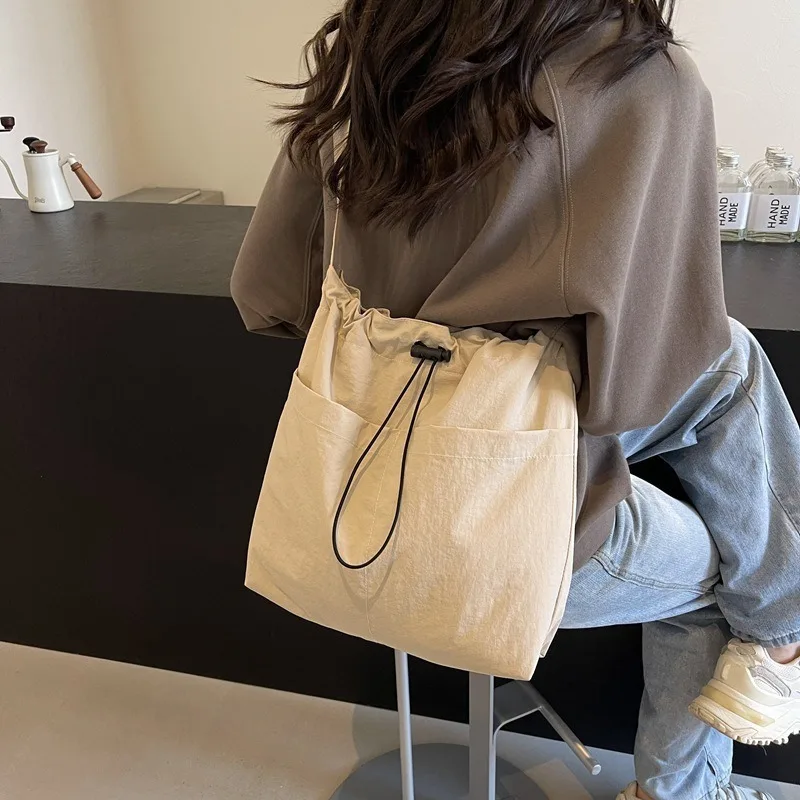Stylish Drawstring Canvas Shoulder Bag with Adjustable Strap Pendant, Lightweight Casual Bucket Bags for Everyday Crossbody Bag
Stylish Drawstring Canvas Shoulder Bag with Adjustable Strap Pendant, Lightweight Casual Bucket Bags for Everyday Crossbody Bag