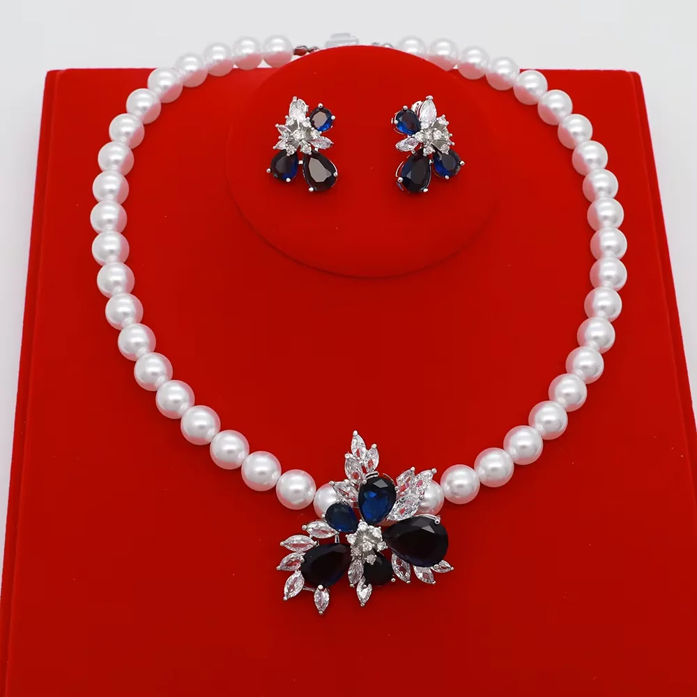 New Charming Women Jewelry Set Exquisite Design Luxury Crystal Zircon Ice Flower Pendant Circular Shape Pearl Necklace Earrings
New Charming Women Jewelry Set Exquisite Design Luxury Crystal Zircon Ice Flower Pendant Circular Shape Pearl Necklace Earrings