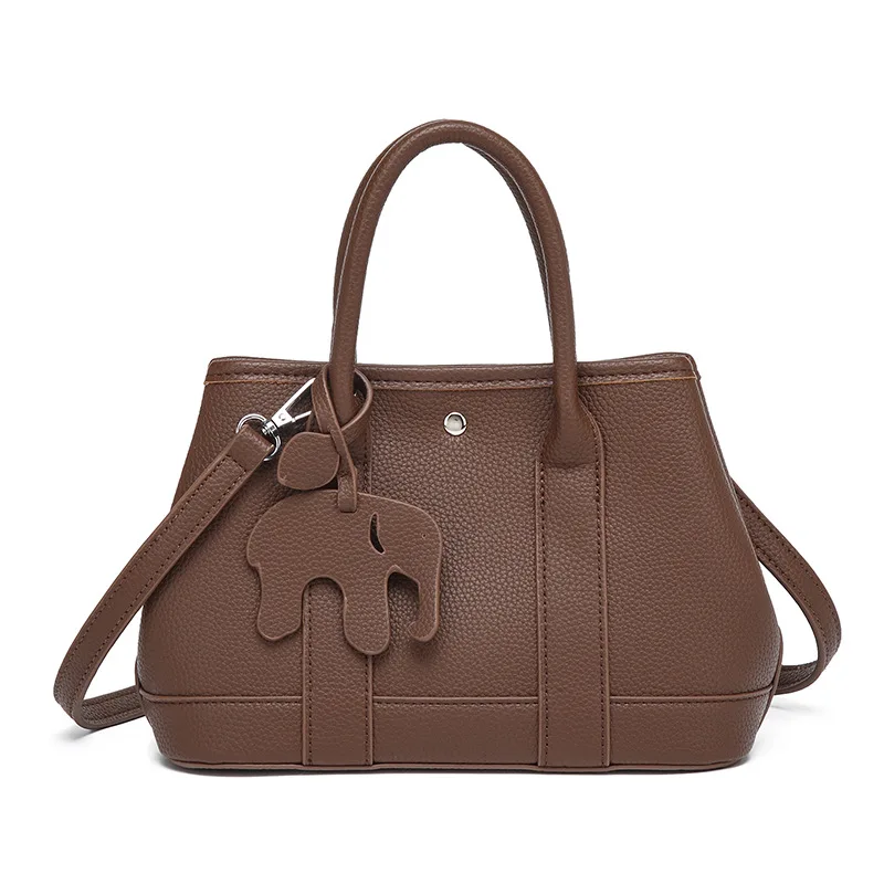 Новинка 2023 года, женская элегантная сумка из искусственной кожи с милой подвеской в виде слона, сумка через плечо, многофункциональная сумка на плечо для работы
Новинка 2023 года, женская элегантная сумка из искусственной кожи с милой подвеской в виде слона, сумка через плечо, многофункциональная сумка на плечо для работы