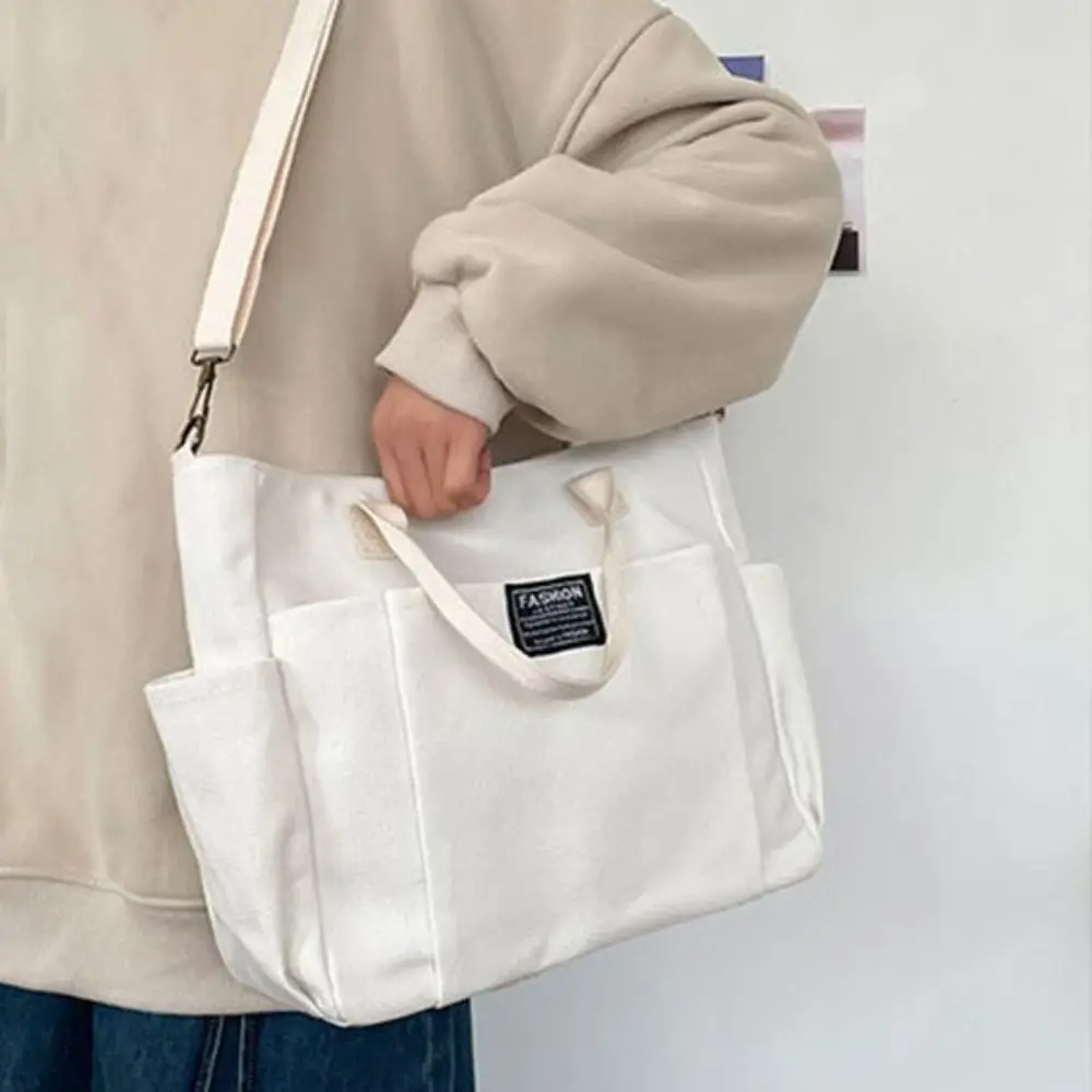 Сплошной цвет, большая вместительная холщовая сумка, портативная простая сумка для покупок, повседневная сумка, парусиновая сумка на плечо, дорожная сумка
Сплошной цвет, большая вместительная холщовая сумка, портативная простая сумка для покупок, повседневная сумка, парусиновая сумка на плечо, дорожная сумка