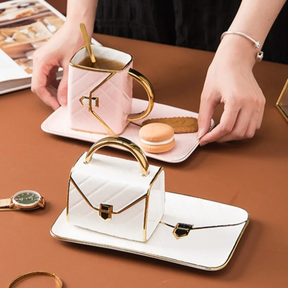 Cute Diamond Bag Ceramic Mug Dish Set with Handle with Cover Spoon Couple Water Cup Handbag Shape Gift Coffee Mug Set
Cute Diamond Bag Ceramic Mug Dish Set with Handle with Cover Spoon Couple Water Cup Handbag Shape Gift Coffee Mug Set