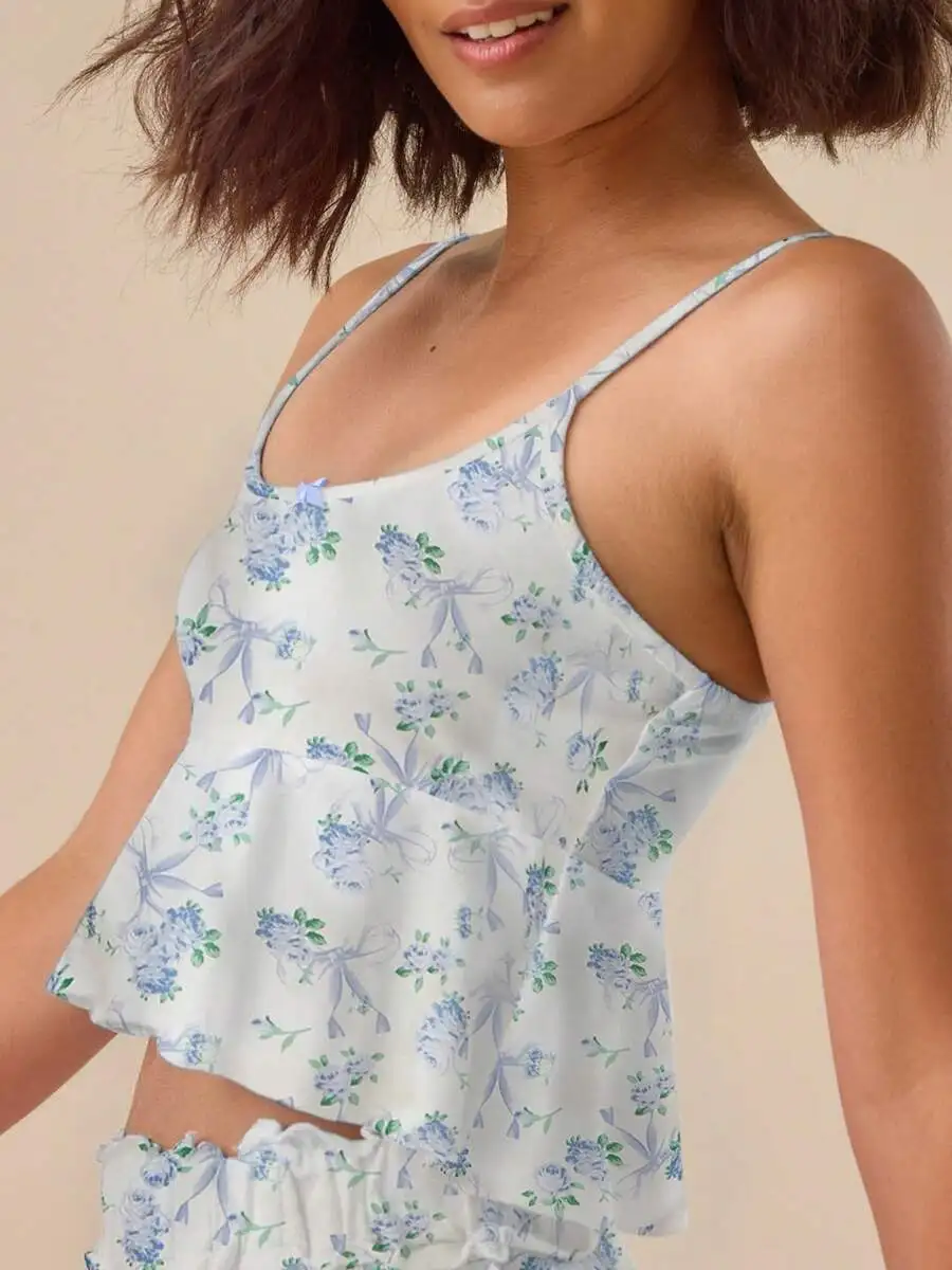 Women Floral Print 2 Piece Pajama Set Spaghetti Strap Cami Top Ruffle Trim Elastic Waist Wide Leg Sleepwear
Women Floral Print 2 Piece Pajama Set Spaghetti Strap Cami Top Ruffle Trim Elastic Waist Wide Leg Sleepwear