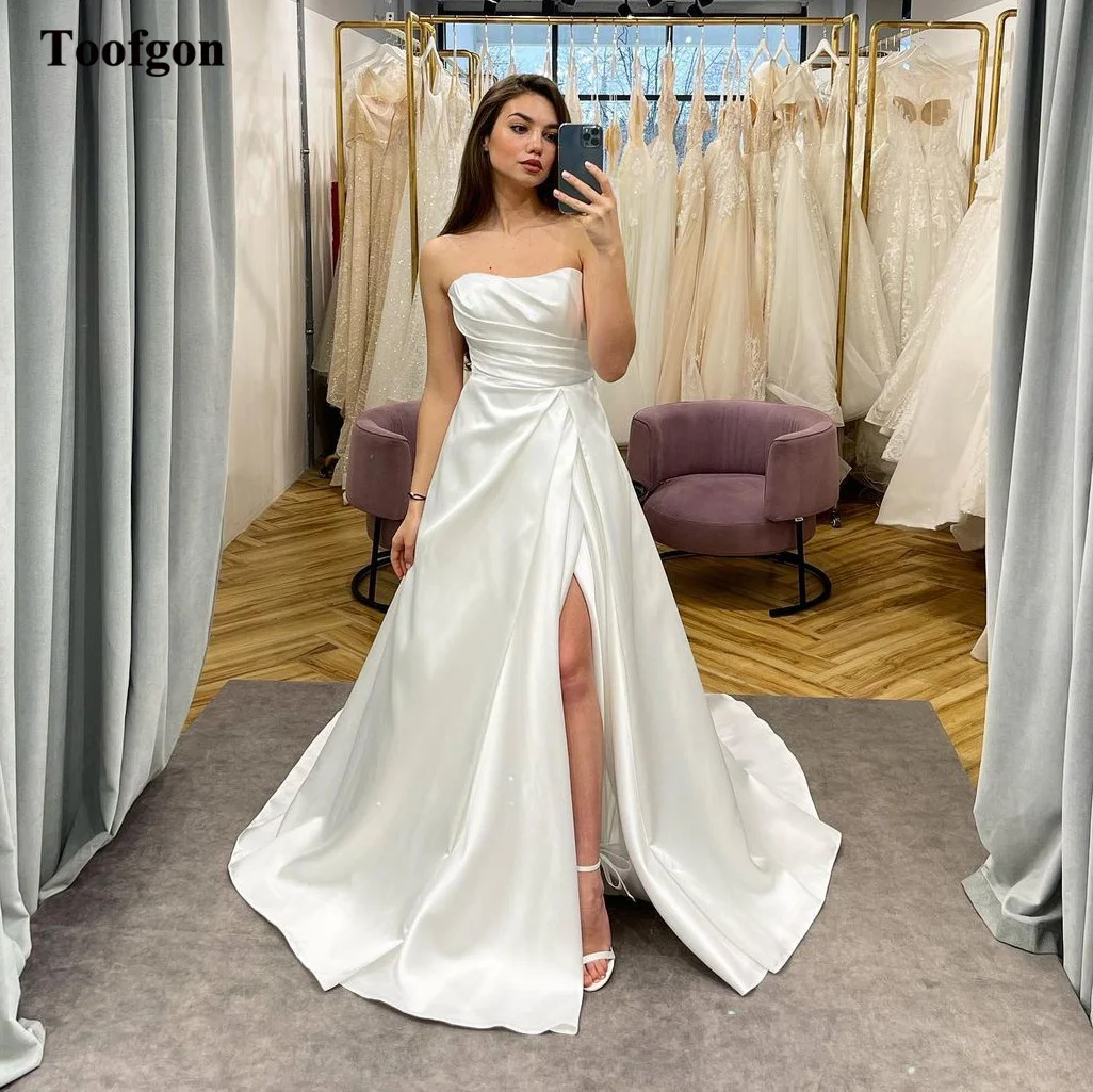 Toofgon New Arrival A Line Satin Bride Wedding Dresses Pleats Strapless High Split Floor Length Bridal Dress vestidos de novia
Toofgon New Arrival A Line Satin Bride Wedding Dresses Pleats Strapless High Split Floor Length Bridal Dress vestidos de novia