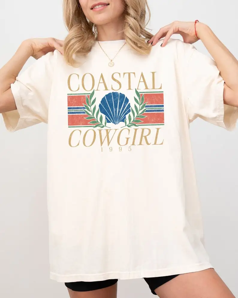 Coastal Cowgirl, Vintage Design, Summer, Beach, Vacation, Holiday, Ocean, Sea Shell Shirt, Comfort Colors Tee
Coastal Cowgirl, Vintage Design, Summer, Beach, Vacation, Holiday, Ocean, Sea Shell Shirt, Comfort Colors Tee