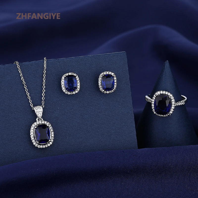ZHFANGIYE Trendy 925 Silver Jewelry Set Ring Earrings Pendant Necklace with Sapphire Gemstone Ornaments for Women Wedding Party
ZHFANGIYE Trendy 925 Silver Jewelry Set Ring Earrings Pendant Necklace with Sapphire Gemstone Ornaments for Women Wedding Party