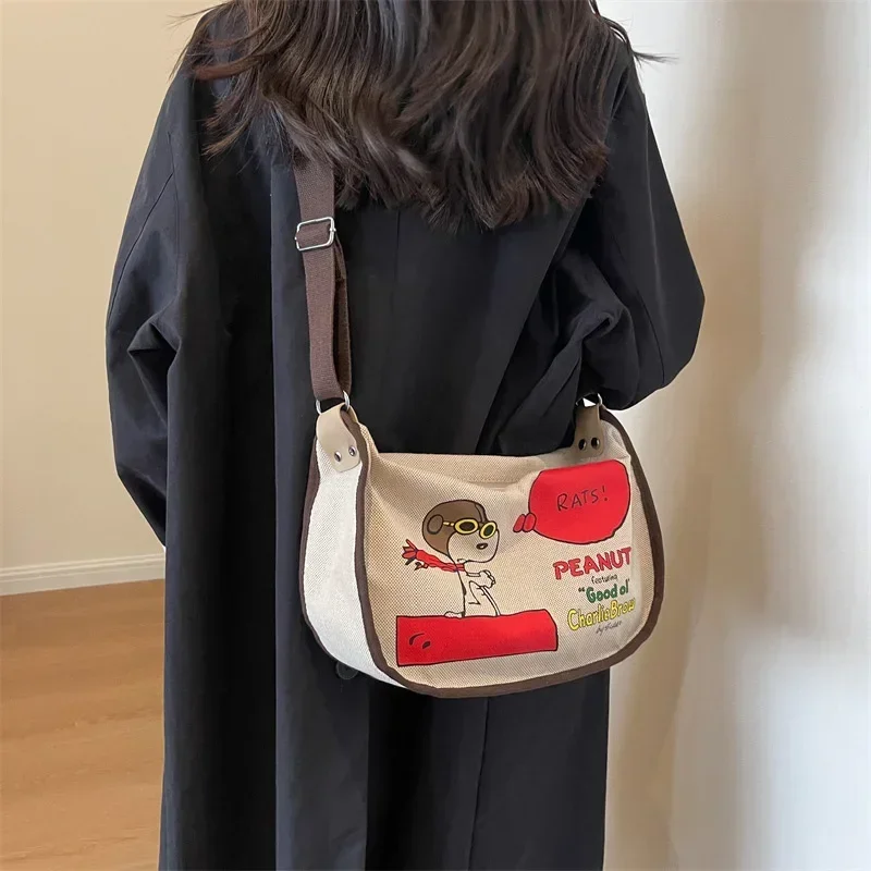 Snoopy Japanese Cartoon Canvas messenger Bag Women's Large Capacity Shoulder Bag girl fashion travel bag 20x36x12cm
Snoopy Japanese Cartoon Canvas messenger Bag Women's Large Capacity Shoulder Bag girl fashion travel bag 20x36x12cm