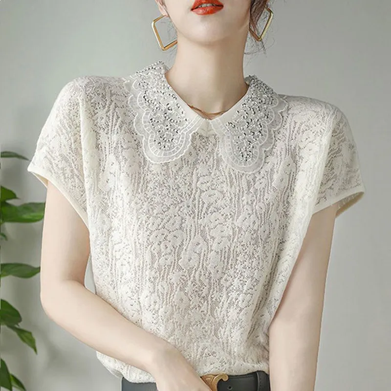 Summer Women's Jacquard Cut-out Knit T-shirt 2026 Luxurious Sequined Peter Pan Collar Tee Office Lady Elegant Breathable Shirt
Summer Women's Jacquard Cut-out Knit T-shirt 2026 Luxurious Sequined Peter Pan Collar Tee Office Lady Elegant Breathable Shirt