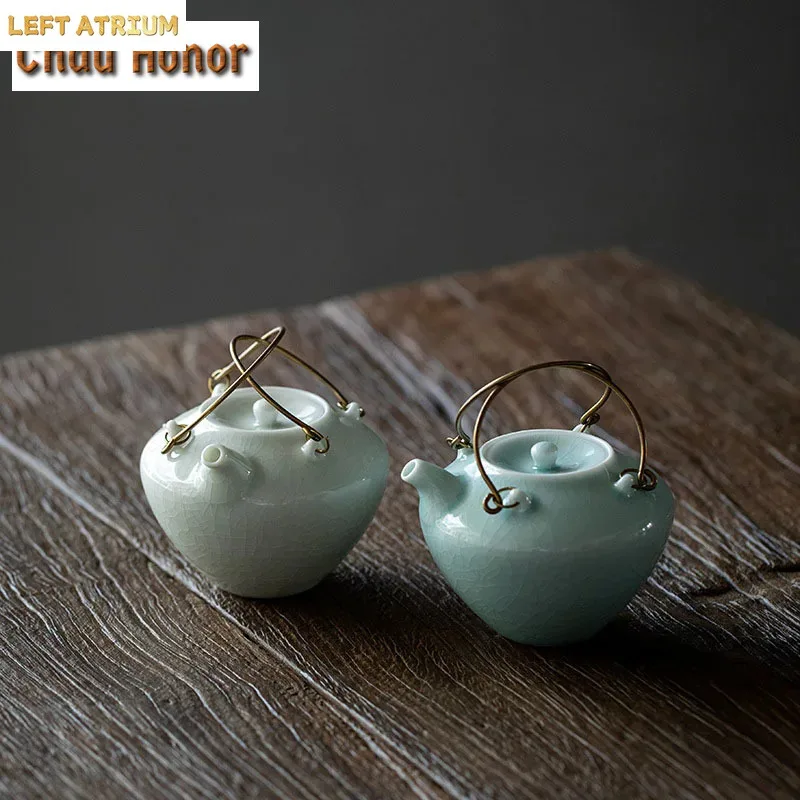 160ML Retro Imitation Song Celadon Gracked Glaze Tea Pot Copper Handle Pot Ceramic Small Teapot Filter Pot Kung Fu Teaware Set
160ML Retro Imitation Song Celadon Gracked Glaze Tea Pot Copper Handle Pot Ceramic Small Teapot Filter Pot Kung Fu Teaware Set