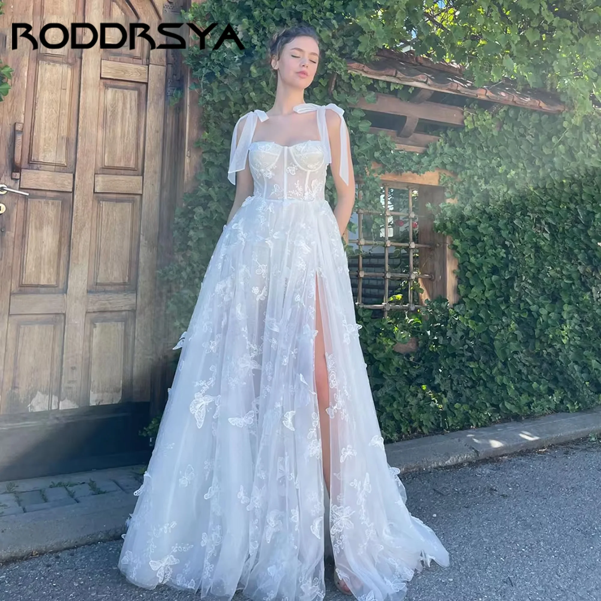 RODDRSYA Butterfliy Lace Tulle Wedding Gown A-Line Sleeveless Bow Straps High Split Fairy Romantic Bridal Dress 2025 Customized
RODDRSYA Butterfliy Lace Tulle Wedding Gown A-Line Sleeveless Bow Straps High Split Fairy Romantic Bridal Dress 2025 Customized