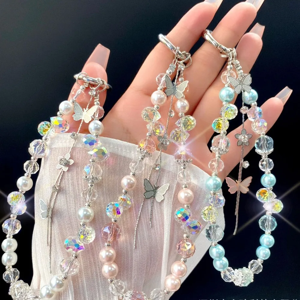Новый ремешок для мобильного телефона с кристаллами и бабочками, ручной бисер, анти-потерянный телефон, ручная веревка, художественные ремесла, автомобильный брелок, орнамент
Новый ремешок для мобильного телефона с кристаллами и бабочками, ручной бисер, анти-потерянный телефон, ручная веревка, художественные ремесла, автомобильный брелок, орнамент