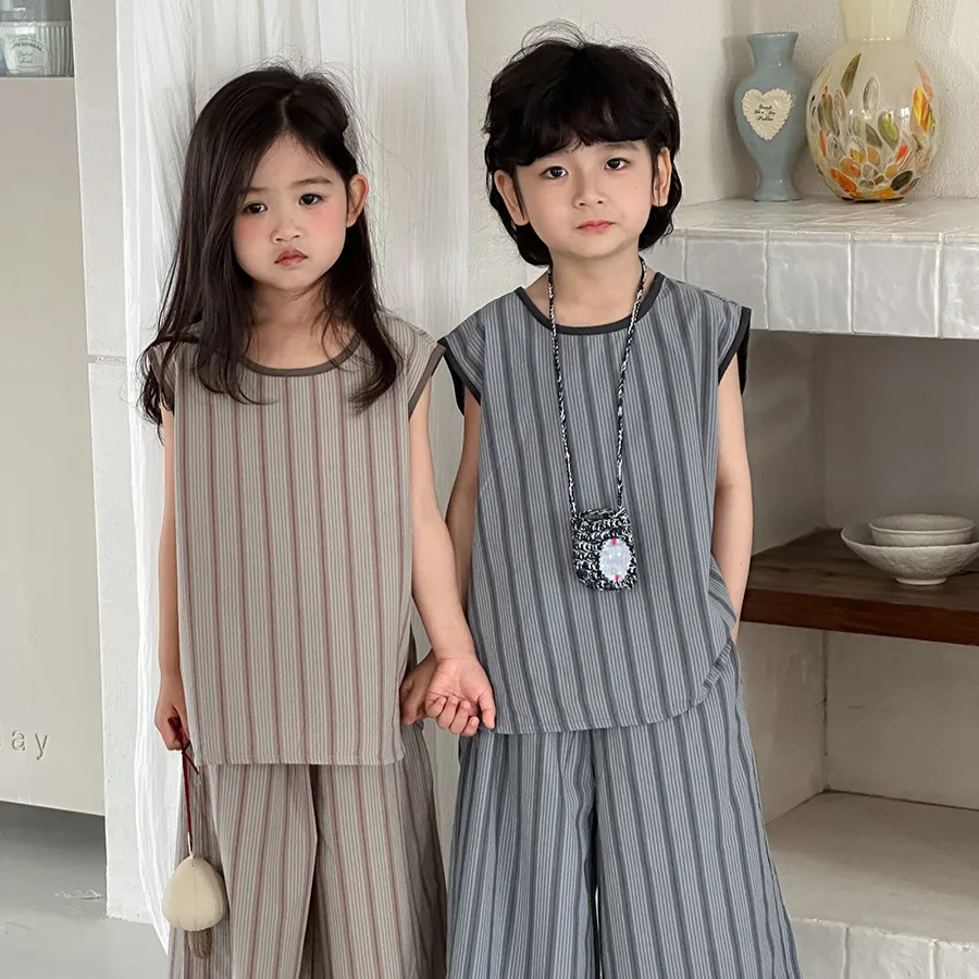 2026 children's summer new vertical stripe vest top, loose seven quarter pants two-piece set for boys and girls
2026 children's summer new vertical stripe vest top, loose seven quarter pants two-piece set for boys and girls
