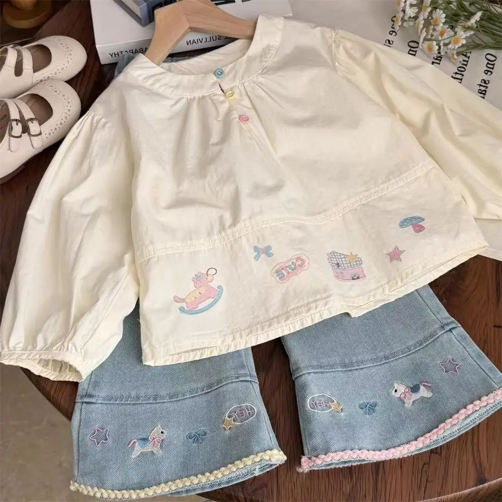 Girls Spring Autumn Fashion Set Cartoon Long Sleeve Doll Shirt + Embroidered Denim Pants 2-Piece Set for Children
Girls Spring Autumn Fashion Set Cartoon Long Sleeve Doll Shirt + Embroidered Denim Pants 2-Piece Set for Children