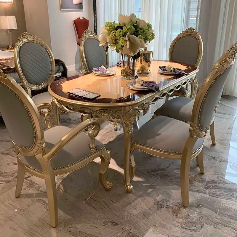 European solid wood oval rectangular dining table and chairs combination luxury restaurant French 6 people gold foil
European solid wood oval rectangular dining table and chairs combination luxury restaurant French 6 people gold foil