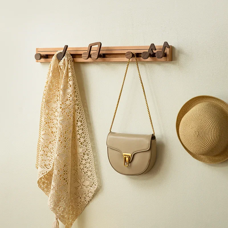 Music note hook into the door entrance solid wood home creative music note row hook no punching hangers behind the door
Music note hook into the door entrance solid wood home creative music note row hook no punching hangers behind the door