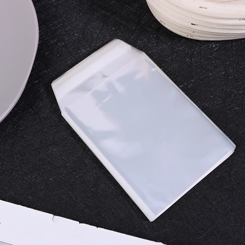 100pcs Pack Graded Card Sleeves Holders Sleeves Bags Transparent Hard Card Sleeve Protective Film Trapezoidal Cutting Dust-proof
100pcs Pack Graded Card Sleeves Holders Sleeves Bags Transparent Hard Card Sleeve Protective Film Trapezoidal Cutting Dust-proof