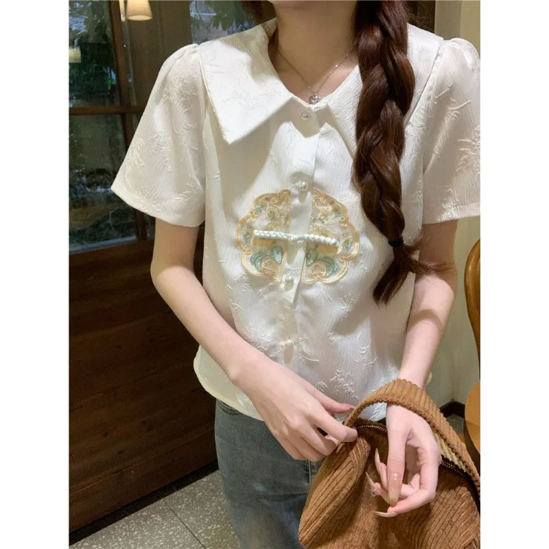 New Chinese Embroidered Shirt Doll Collar National Style Shirt Women's 2026 New Summer Niche Design Short-sleeved Top
New Chinese Embroidered Shirt Doll Collar National Style Shirt Women's 2026 New Summer Niche Design Short-sleeved Top