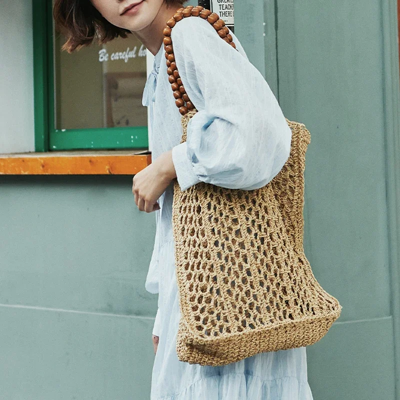 Fashion Hollow Large Straw Tote Bag Wooden Beaded Handle Women Handbags Paper Woven Shoulder Bags Casual Summer Beach Big Purse
Fashion Hollow Large Straw Tote Bag Wooden Beaded Handle Women Handbags Paper Woven Shoulder Bags Casual Summer Beach Big Purse