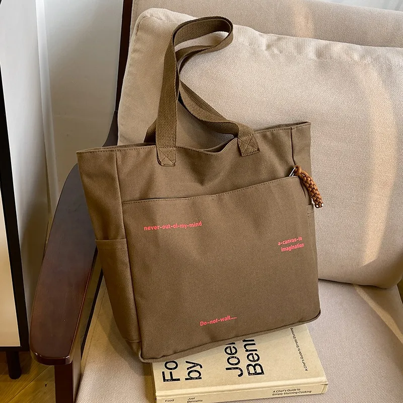 2025 new commuter large-capacity one-shoulder canvas bag female Korean version of Joker portable shopping bag Tote bag
2025 new commuter large-capacity one-shoulder canvas bag female Korean version of Joker portable shopping bag Tote bag