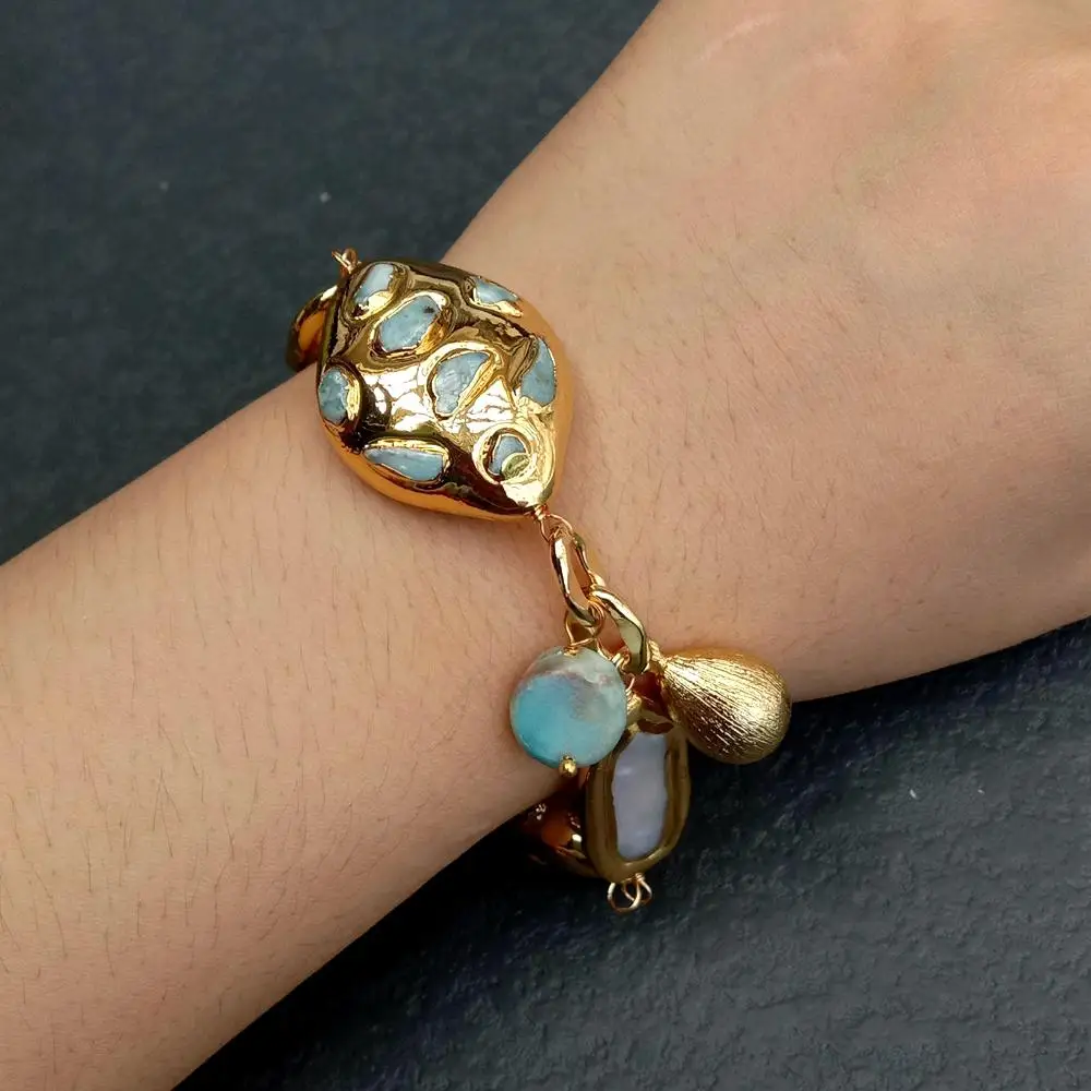 14x26mm Freshwater Cultured White Biwa Pearl 25x34mm Blue Larimar Beaded Charm Bracelet
14x26mm Freshwater Cultured White Biwa Pearl 25x34mm Blue Larimar Beaded Charm Bracelet