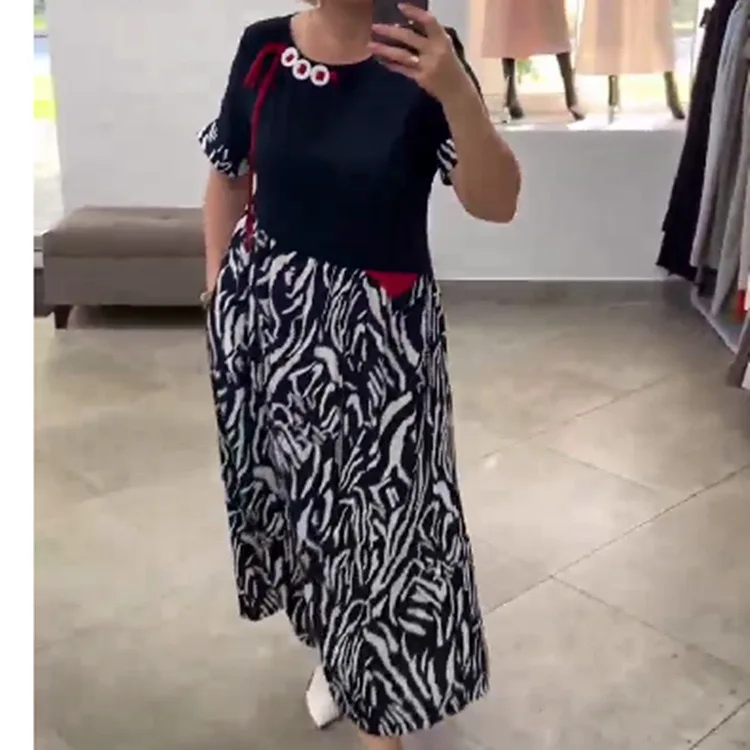 Spring and Autumn Fashionable Casual Splicing Button Hem Printing Temperament Short-sleeved Long Skirt 
Spring and Autumn Fashionable Casual Splicing Button Hem Printing Temperament Short-sleeved Long Skirt