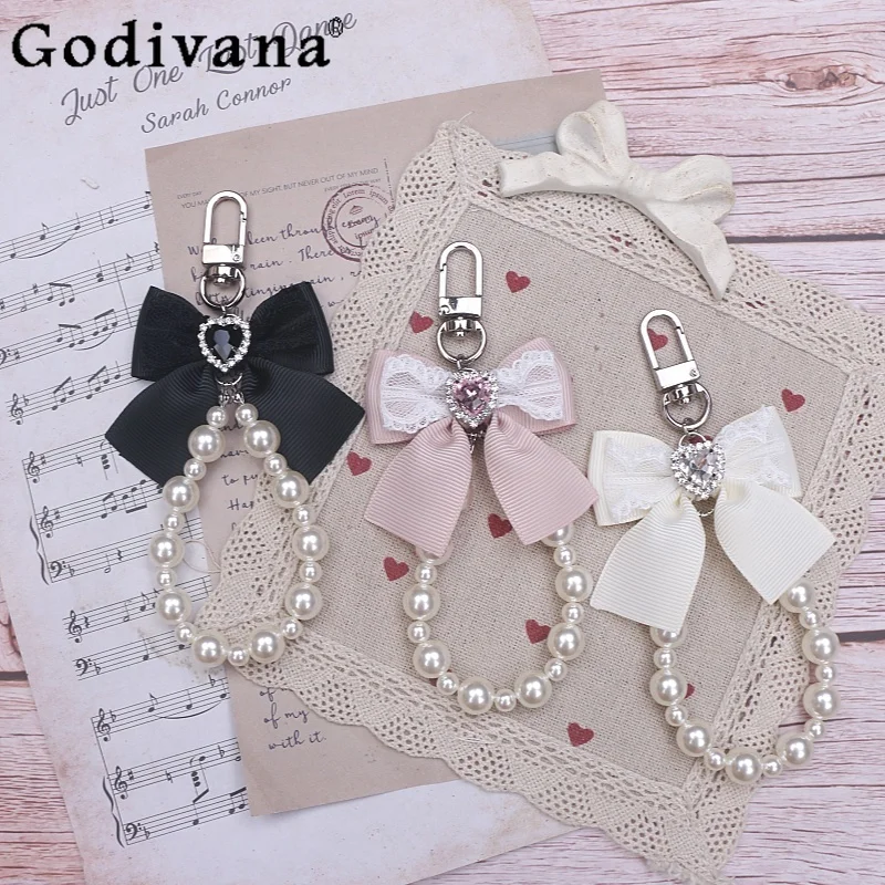 Японский милый женский брелок в форме сердца со стразами и жемчугом, аксессуар, цепочка для телефона, сумка, подвеска в стиле Лолиты
Японский милый женский брелок в форме сердца со стразами и жемчугом, аксессуар, цепочка для телефона, сумка, подвеска в стиле Лолиты