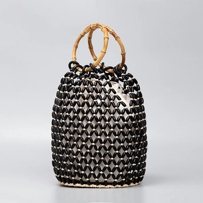 Brand Wooden Bead Handbag New Design Summer Women Hollow Weaving Seaside Vacation Commuting Large Capacity Bamboo Bucket Handbag
Brand Wooden Bead Handbag New Design Summer Women Hollow Weaving Seaside Vacation Commuting Large Capacity Bamboo Bucket Handbag