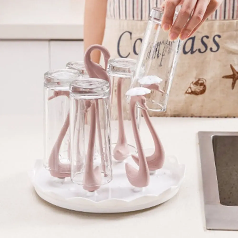 Креативный вращающийся держатель для чашки в форме лебедя, пластиковый держатель для хранения чашек, съемная вращающаяся нижняя опорная рамка для чашки 
Креативный вращающийся держатель для чашки в форме лебедя, пластиковый держатель для хранения чашек, съемная вращающаяся нижняя опорная рамка для чашки
