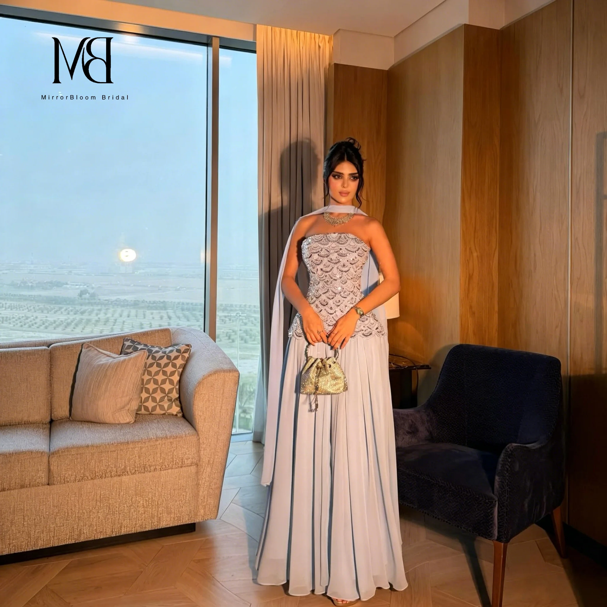 Elegant blue strapless sleeveless floor-length formal gown featuring sequin embroidery and a matching shawl
Elegant blue strapless sleeveless floor-length formal gown featuring sequin embroidery and a matching shawl