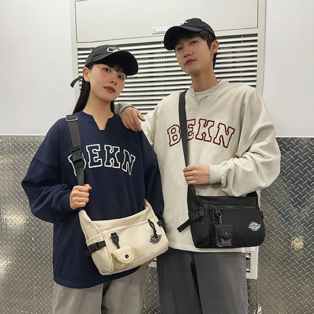 Multifunctional Crossbody Message Bag Sports Waterproof Nylon Shoulder Bag Handbag Street Style Square Shoulder Bag Unisex
Multifunctional Crossbody Message Bag Sports Waterproof Nylon Shoulder Bag Handbag Street Style Square Shoulder Bag Unisex