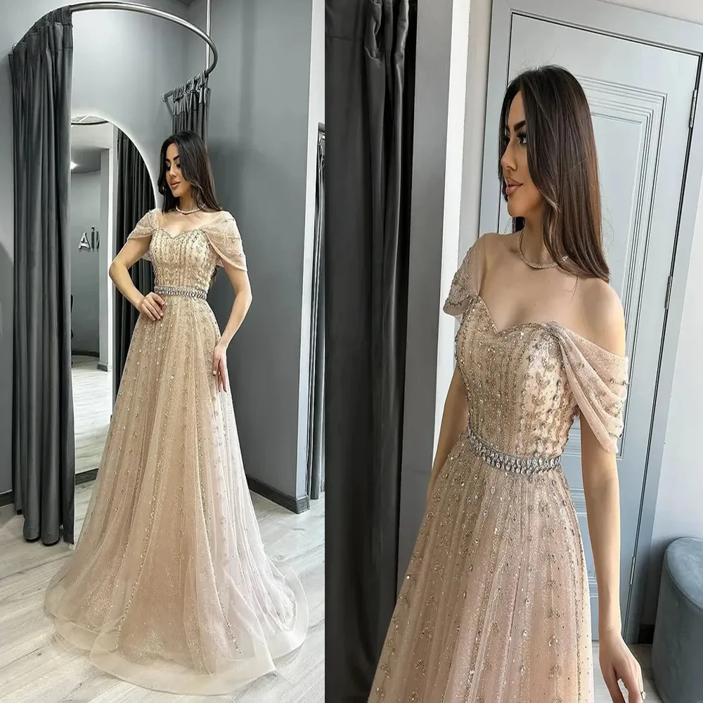 Custom Exquisite Off Shoulder Tulle Shiny Evening Dress A-line Backless Beaded Crystal Party Gown with Sweep Court فساتين سهره
Custom Exquisite Off Shoulder Tulle Shiny Evening Dress A-line Backless Beaded Crystal Party Gown with Sweep Court فساتين سهره