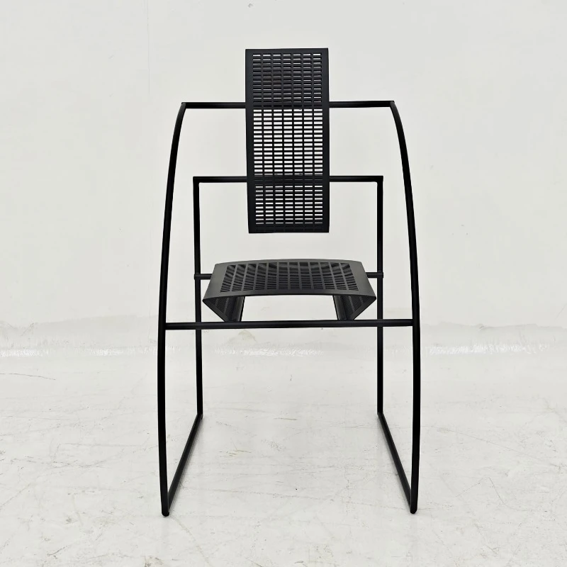 Modern arched frame metal dining chair with matte black finish, breathable perforated seat back, minimalist design
Modern arched frame metal dining chair with matte black finish, breathable perforated seat back, minimalist design