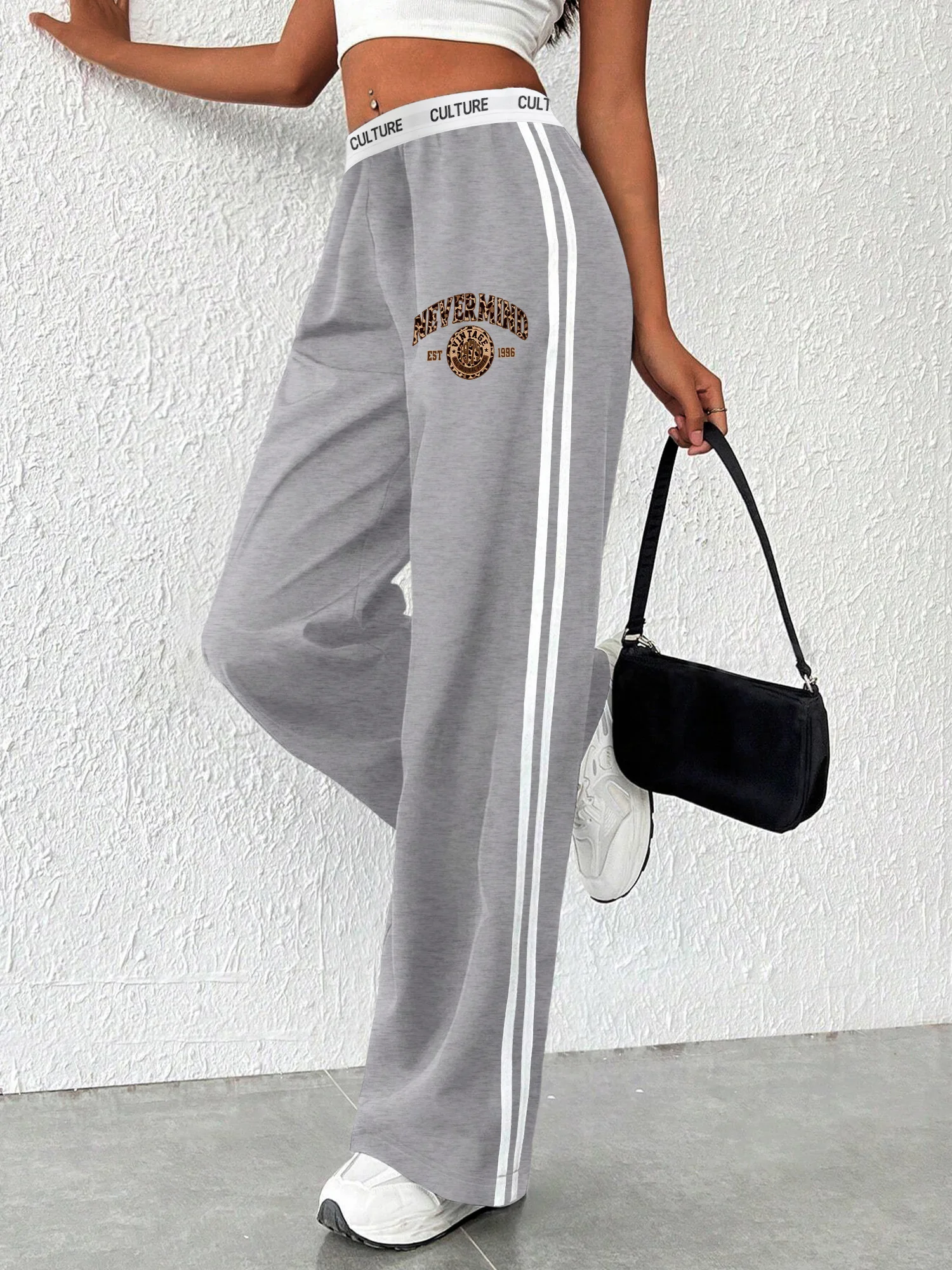 Striped Wide Leg Pants with Leopard Print "Empowered" Logo, Elastic Waistband, Casual Streetwear
Striped Wide Leg Pants with Leopard Print "Empowered" Logo, Elastic Waistband, Casual Streetwear