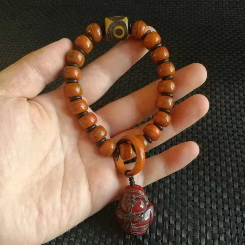 Antique ox bone Buddhist beads, paired with a three-eyed dzi bead and a ox horn wealth god
Antique ox bone Buddhist beads, paired with a three-eyed dzi bead and a ox horn wealth god