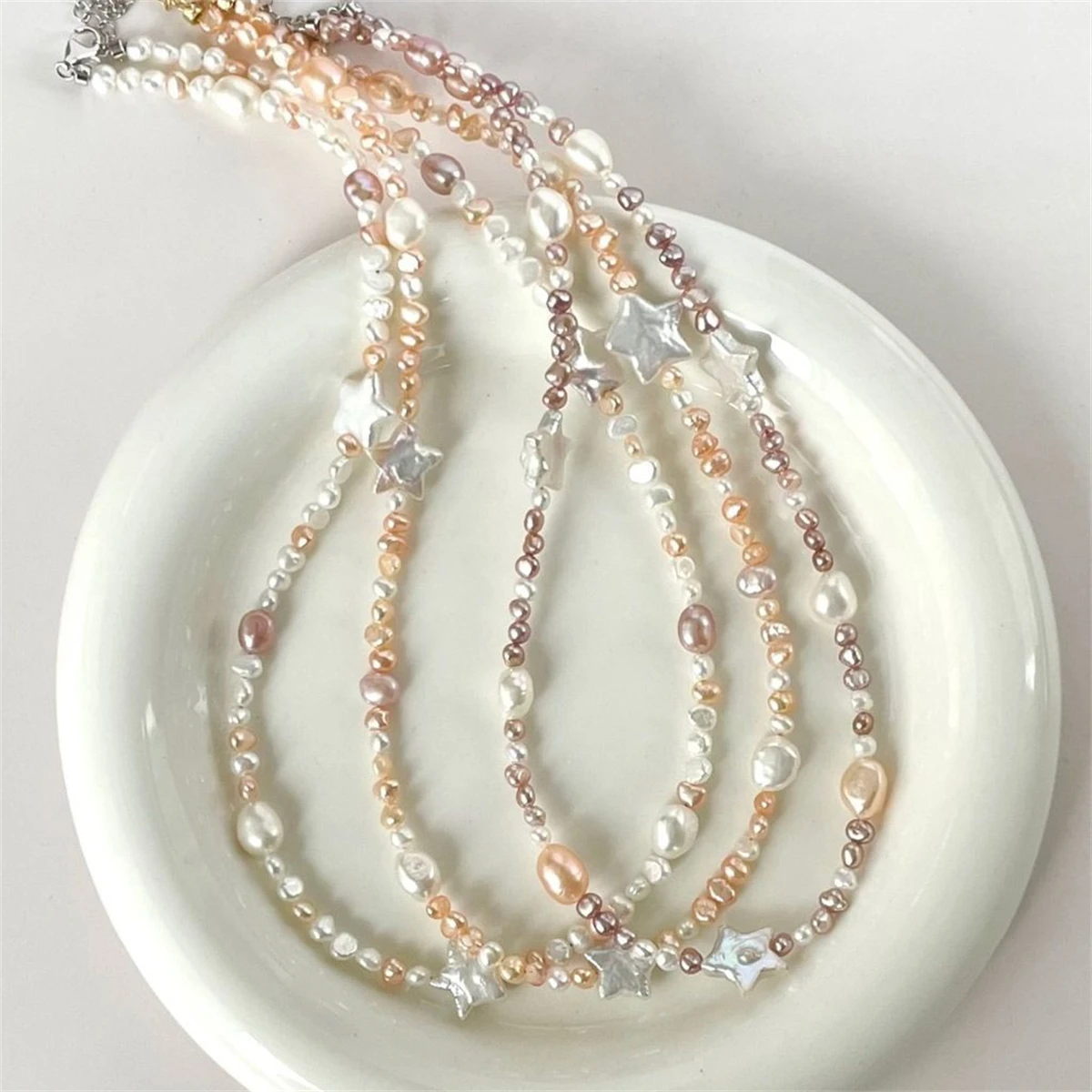 Fashionable retro titanium steel star chain pearl pendant necklace gold-plated color preservation women's gift
Fashionable retro titanium steel star chain pearl pendant necklace gold-plated color preservation women's gift