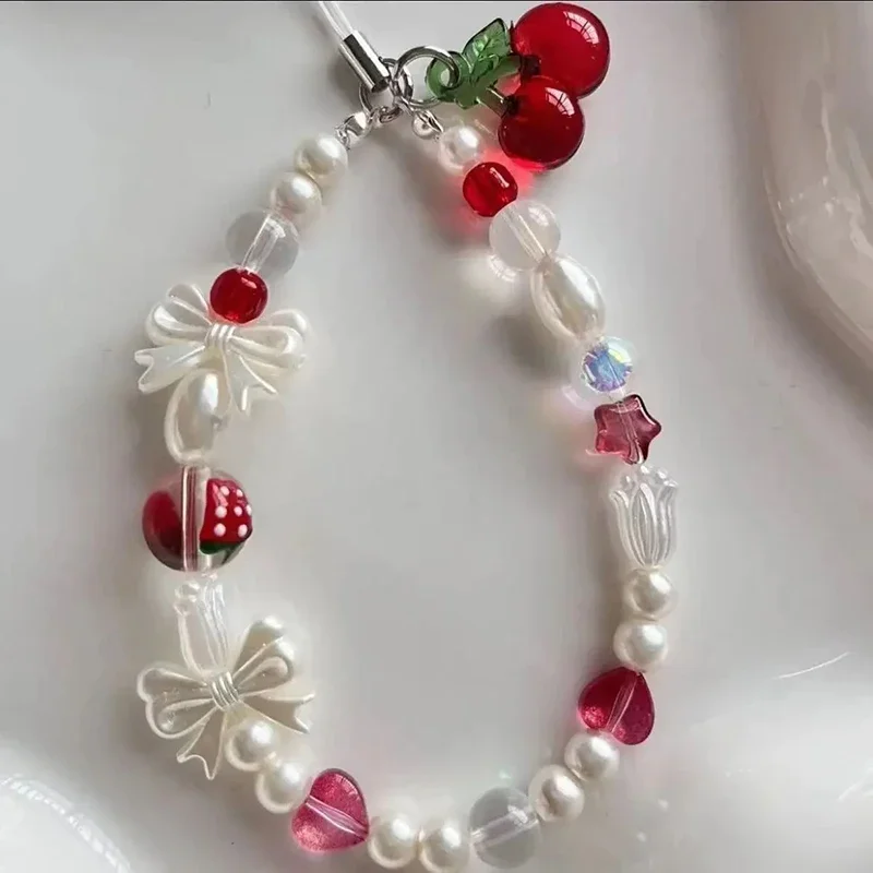 Korean Cute Red Cherry Bow Pearl Phone Chain Lanyard Charm Strap Wrist Bead Hanging Cord Bracelet Keychain For iPhone Girl Rope
Korean Cute Red Cherry Bow Pearl Phone Chain Lanyard Charm Strap Wrist Bead Hanging Cord Bracelet Keychain For iPhone Girl Rope