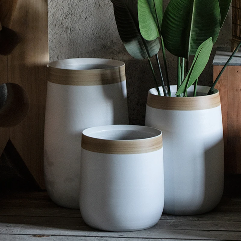 Modern green Nordic high-end sense white large mouth ornament vase ceramic flower planting pot living room flower arrangement
Modern green Nordic high-end sense white large mouth ornament vase ceramic flower planting pot living room flower arrangement