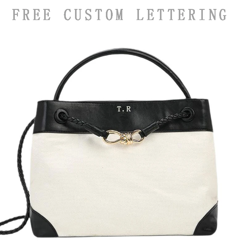 Canvas spliced PU leather tote bag 2025 new luxury design free initials large capacity bow buckle vintage casual women handbag
Canvas spliced PU leather tote bag 2025 new luxury design free initials large capacity bow buckle vintage casual women handbag