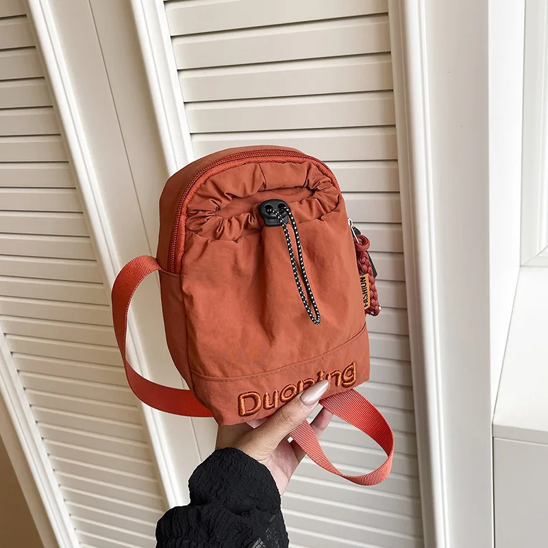 Waterproof walking nylon canvas bag 2026 trendy drawstring change casual solid color lightweight crossbody phone bag
Waterproof walking nylon canvas bag 2026 trendy drawstring change casual solid color lightweight crossbody phone bag