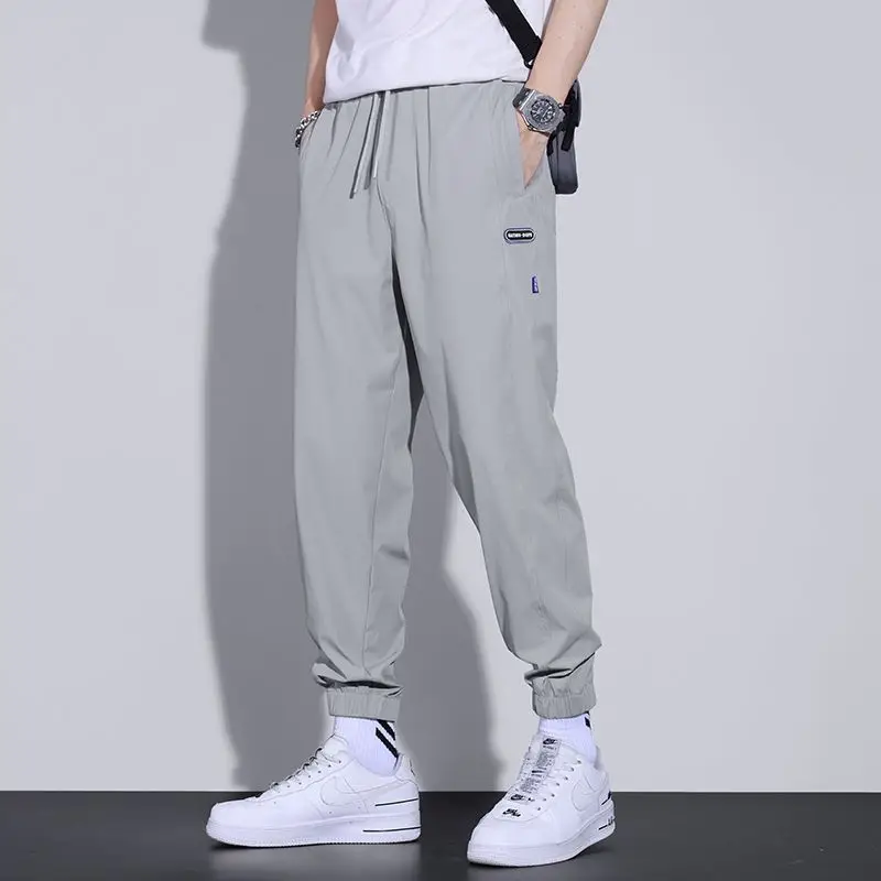 Summer Thin Casual Pants Men Loose-Fit Tappered Trousers Fashion Brand All-Matching Youth Ice Silk Leggings Men Sweatpants Black
Summer Thin Casual Pants Men Loose-Fit Tappered Trousers Fashion Brand All-Matching Youth Ice Silk Leggings Men Sweatpants Black