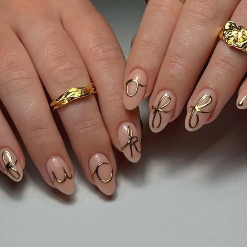 3D Gold Lines Bowknot Nail Art Wearable Fashion Nude Almond Fake Nails Detachable Finished False Nails Press on Nails with Glue
3D Gold Lines Bowknot Nail Art Wearable Fashion Nude Almond Fake Nails Detachable Finished False Nails Press on Nails with Glue