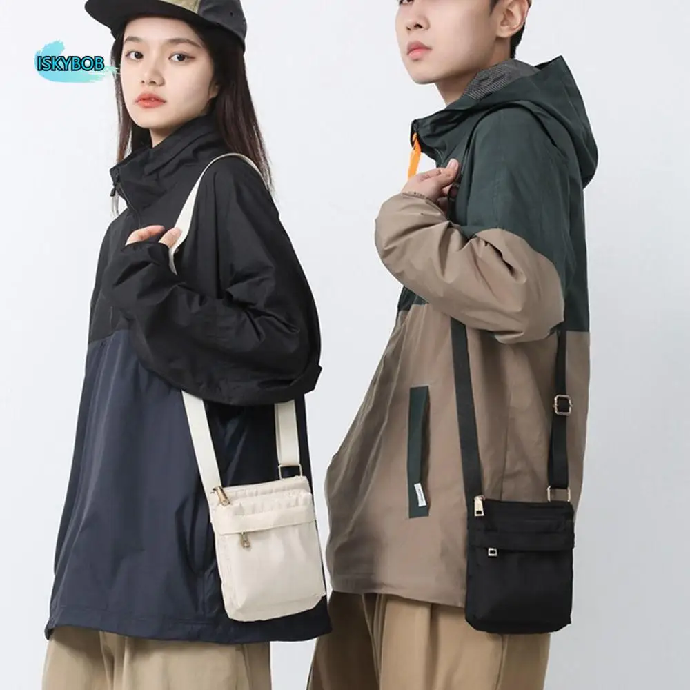 Multifunctional Crossbody Phone Pouch Handheld Street Style Nylon Shoulder Bag Korean Style Solid Color Men Square Bag
Multifunctional Crossbody Phone Pouch Handheld Street Style Nylon Shoulder Bag Korean Style Solid Color Men Square Bag