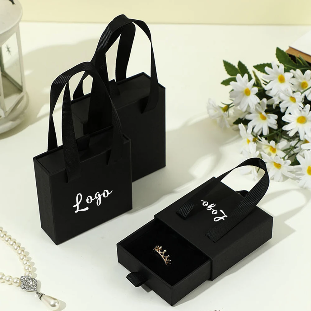 Custom Logo Handbag Ribbon Fashion Jewelry Packaging Portable Drawer Box Earring Ring Necklace Bracelet Wedding Gift Paper Boxes
Custom Logo Handbag Ribbon Fashion Jewelry Packaging Portable Drawer Box Earring Ring Necklace Bracelet Wedding Gift Paper Boxes