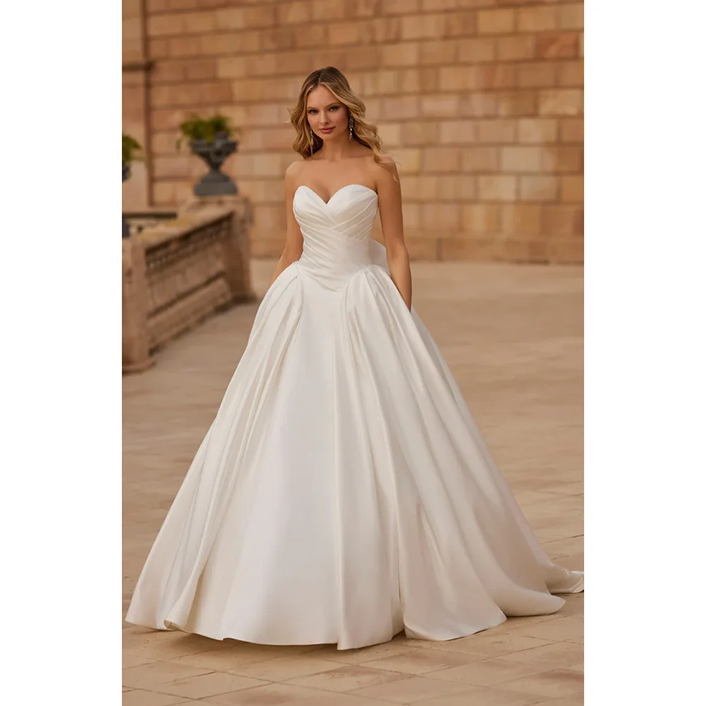 Великолепное бальное платье, свадебные платья, индивидуальное свадебное платье с вырезом в форме сердца, рюшами и цветами, простой атласный корсет со шлейфом, 2025 г.
Великолепное бальное платье, свадебные платья, индивидуальное свадебное платье с вырезом в форме сердца, рюшами и цветами, простой атласный корсет со шлейфом, 2025 г.