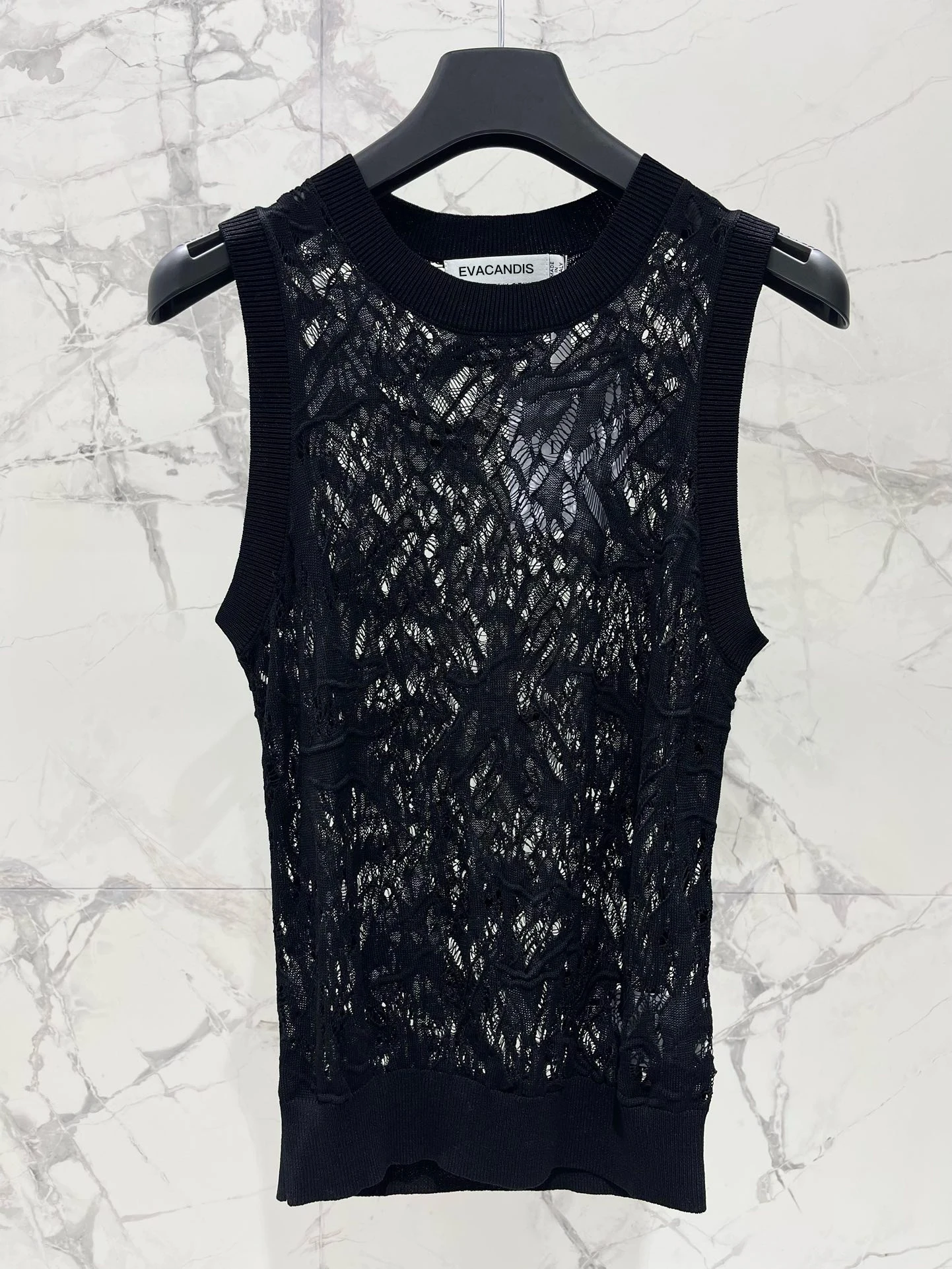 EVACANDIS New Hollow Out O-Neck Knitted Sleeveless Pullover Tops Women Summer Chic Elegant Sweet Solid Casual High Quality
EVACANDIS New Hollow Out O-Neck Knitted Sleeveless Pullover Tops Women Summer Chic Elegant Sweet Solid Casual High Quality