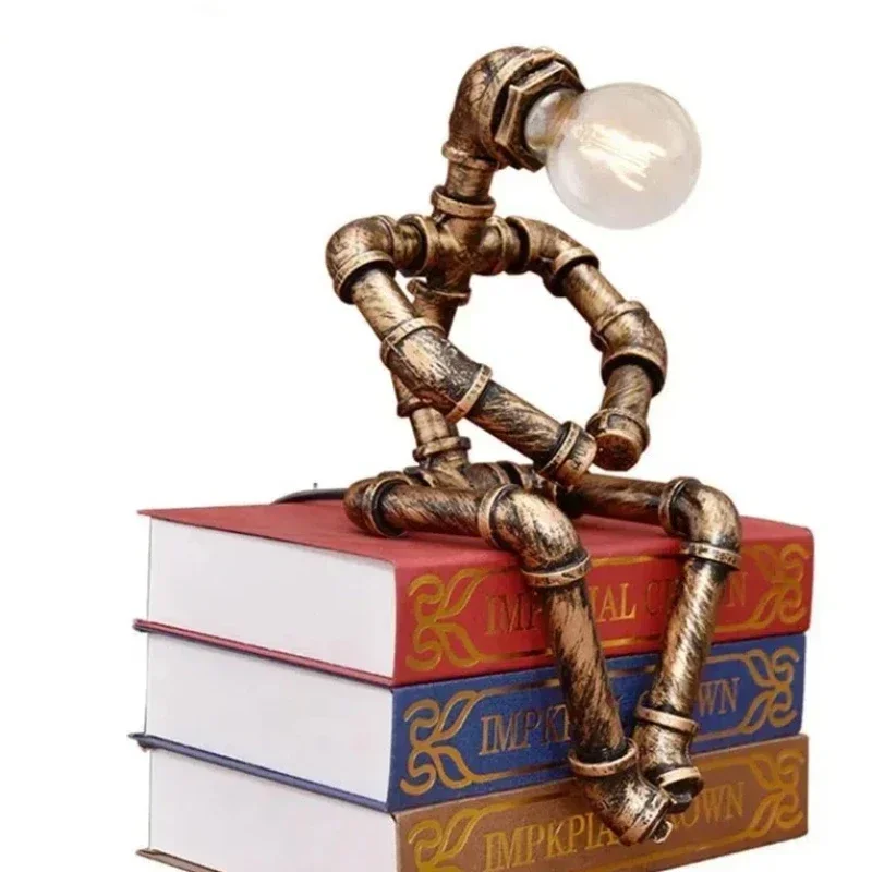 Винтажная настольная лампа в стиле стимпанк, уникальный светильник в индустриальном стиле, робот, прикроватная настольная лампа для спальни, ресторана, кафе, украшения
Винтажная настольная лампа в стиле стимпанк, уникальный светильник в индустриальном стиле, робот, прикроватная настольная лампа для спальни, ресторана, кафе, украшения