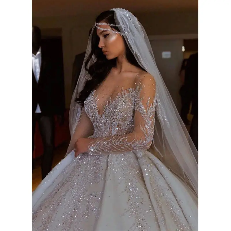 Satin Ball Gown Wedding Dress Sheer Neck Long Sleeves Stones Beaded Crystal Lace Applique Princess Bridal Dress 2023
Satin Ball Gown Wedding Dress Sheer Neck Long Sleeves Stones Beaded Crystal Lace Applique Princess Bridal Dress 2023