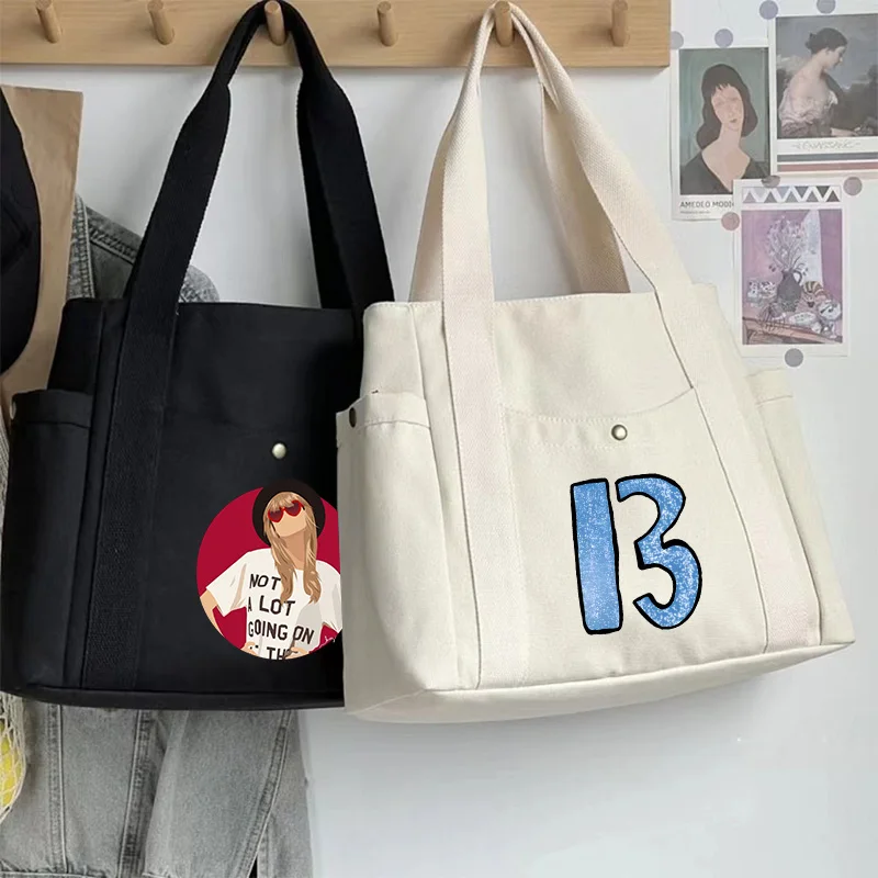 Taylors Swifts Handbags for Women Popular Singer Merch Canvas Shopper Bag Fashion Korean Shoulder Bag Fans Birthday Gifts
Taylors Swifts Handbags for Women Popular Singer Merch Canvas Shopper Bag Fashion Korean Shoulder Bag Fans Birthday Gifts