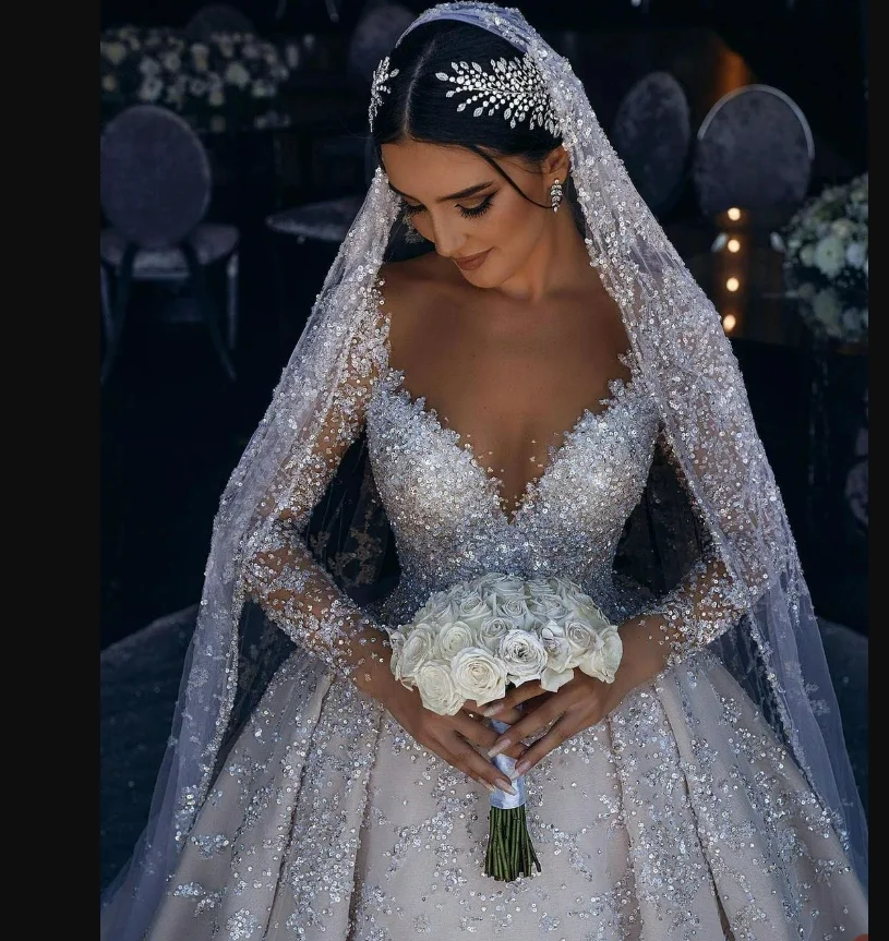 Customized Illusion Neck Sparkly Beads Sequins Luxury Wedding Dress for Bride Long Sleeves Backless Cathedral Train Bridal Gown
Customized Illusion Neck Sparkly Beads Sequins Luxury Wedding Dress for Bride Long Sleeves Backless Cathedral Train Bridal Gown